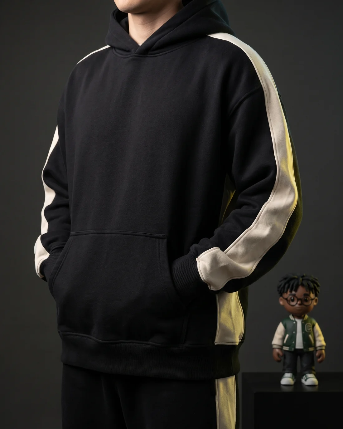 A black heavyweight MEYO hoodie laid flat