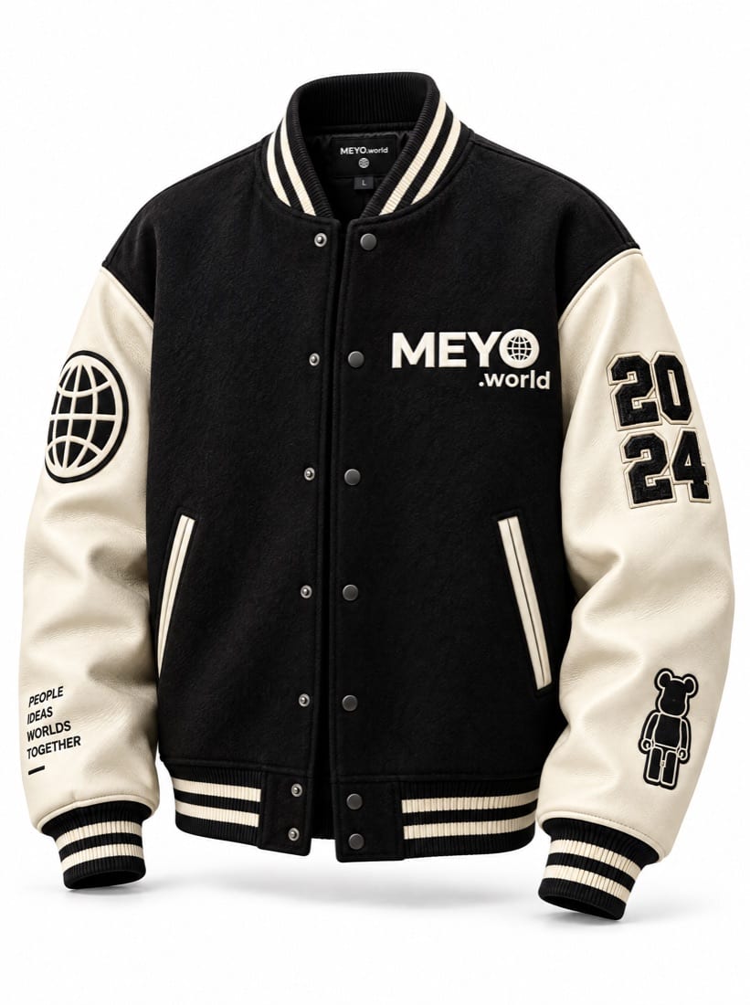A black and cream MEYO varsity jacket with globe and 2024 sleeve patches